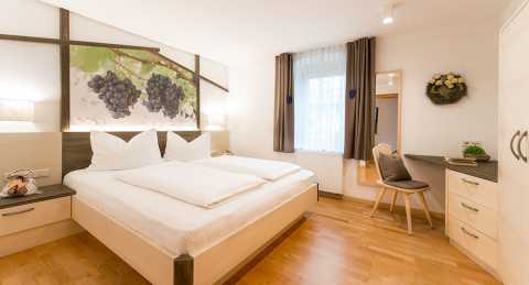 Spacious double bedrooms in the holiday apartments at Stöckerhof